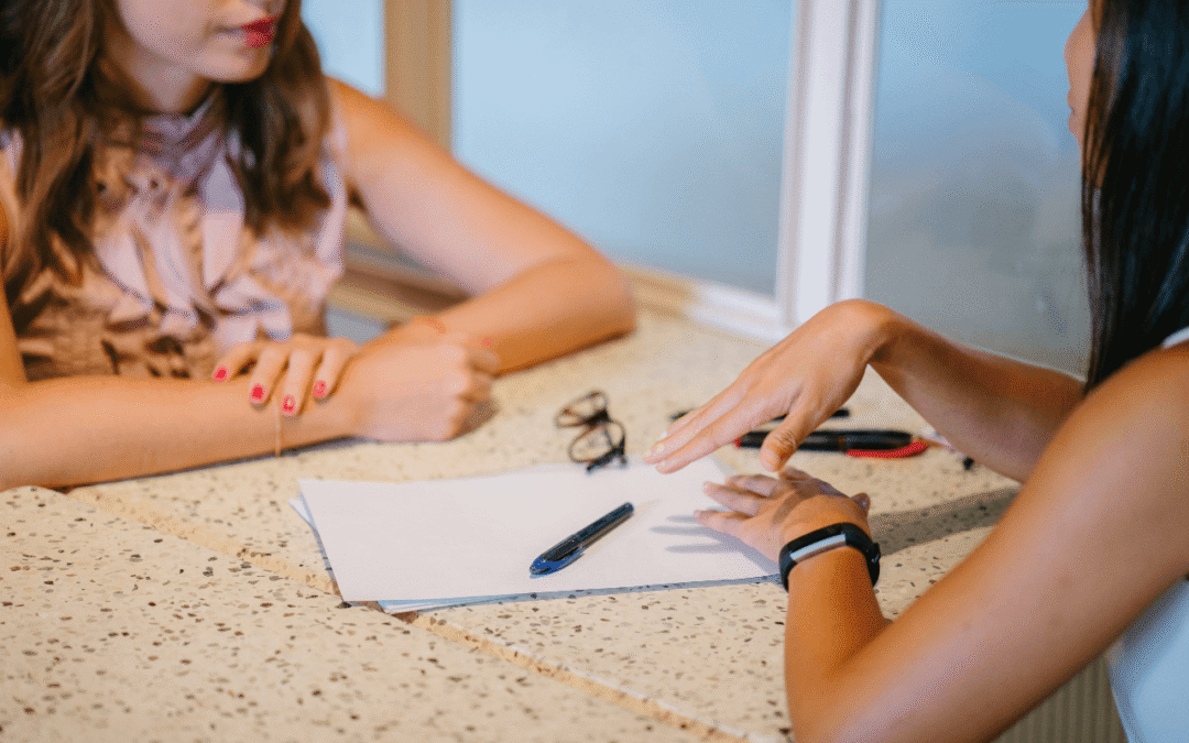 Women Having A Serious Conversation At Work