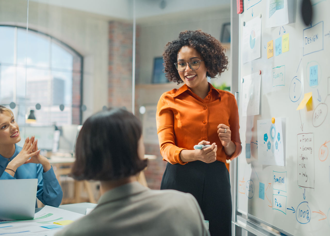 Female-manager-leading-team-at-meeting